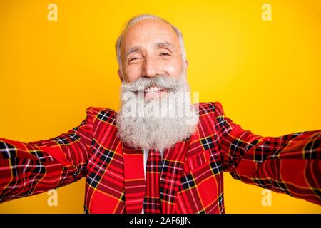 Closeup photo of cool look grandpa guy white stylish long beard making modern selfies wear hipster tartan blazer tie costume clothes isolated yellow Stock Photo