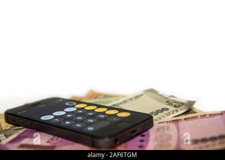 Indian Currency with Mobile phone, Two Thousand and Five Hundred Rupees Stock Photo