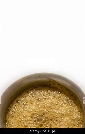 South Indian coffee served in steel glasses - white background Stock Photo