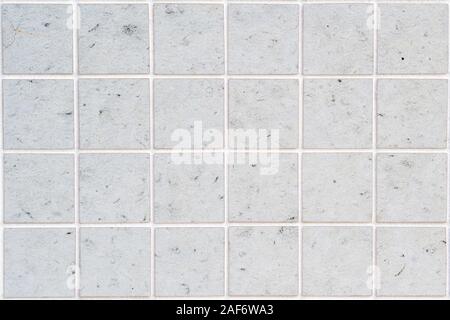 dirty white concrete wall tile with 24 squares in rectangular form Stock Photo