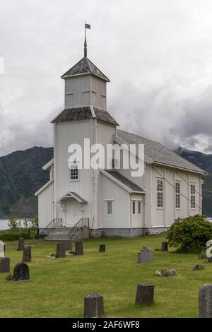 Arctic fjord church and bell tower view, shot under bright cloudy light at Gimsoy, Gimsoya, Lofoten, Norway