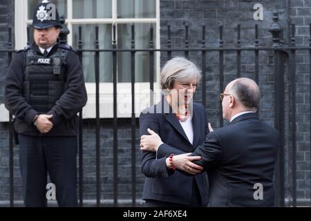 London, Britain. 17th February, 2017. Theresa May, the British Prime Minister, greeting French prime minister Bernard Cazeneuve, as he arrives at 10 D Stock Photo