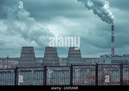 of large pipes belching smoke from thermal power plants Stock Photo