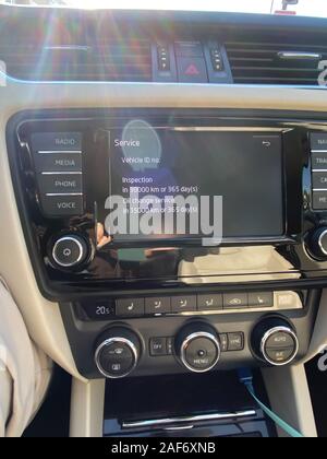 Paris, France - Oct 25, 2019: Modern Skoda car dashboard with Service information to be performed in 15000 kilometers or 365 days Stock Photo