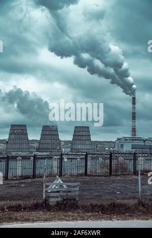 of large pipes belching smoke from thermal power plants Stock Photo