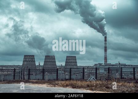 of large pipes belching smoke from thermal power plants Stock Photo