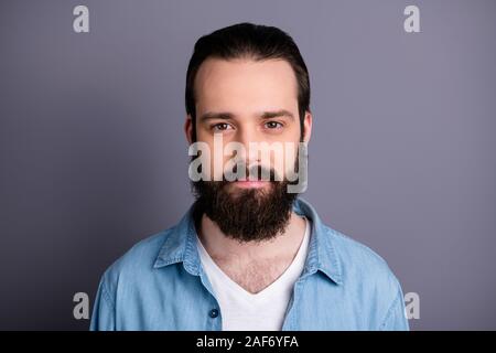 Closeup photo of amazing macho guy serious perfect appearance neat long hairdo bristle young promoted boss chief wear casual denim outfit isolated Stock Photo