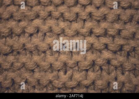 Knitted texture, brown thread pattern, knitting background Stock Photo