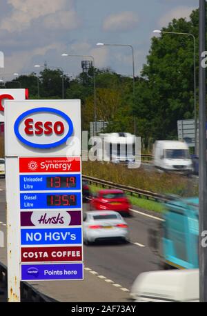 traffic passing esso garage forecourt by the A1/M motorway skellow yorkshire united kingdom Stock Photo