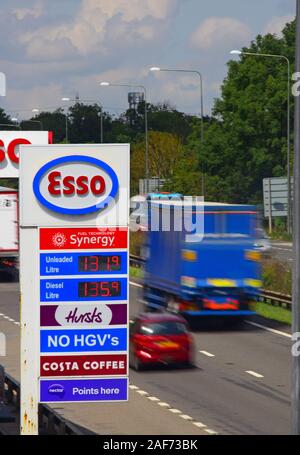 traffic passing esso garage forecourt by the A1/M motorway skellow yorkshire united kingdom Stock Photo