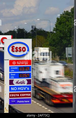 traffic passing esso garage forecourt by the A1/M motorway skellow yorkshire united kingdom Stock Photo