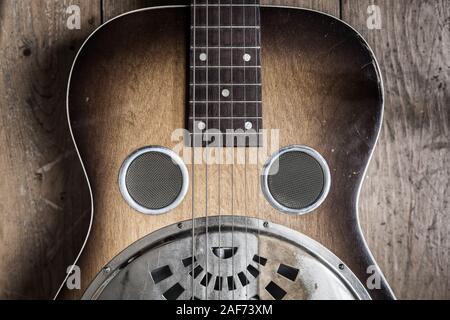 A Dobro guitar on a wooden background Stock Photo