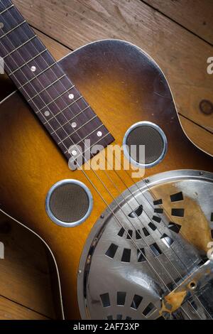 A Dobro guitar on a wooden background Stock Photo