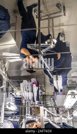 View into the laundry room of the cruise ship Mein Schiff 1. According to the hotel manager, 2 to 4 tons of bed linen, towels, tablecloths etc. are washed daily in the laundry. On embarkation days the quantity increases to 12 to 14 tons. (14 Sept 2019) | usage worldwide Stock Photo