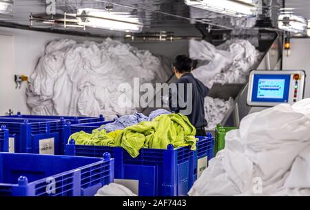 View into the laundry room of the cruise ship Mein Schiff 1. According to the hotel manager, 2 to 4 tons of bed linen, towels, tablecloths etc. are washed daily in the laundry. On embarkation days the quantity increases to 12 to 14 tons. (14 Sept 2019) | usage worldwide Stock Photo