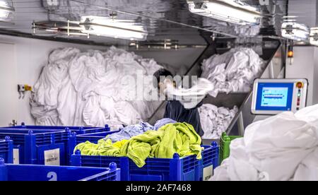 View into the laundry room of the cruise ship Mein Schiff 1. According to the hotel manager, 2 to 4 tons of bed linen, towels, tablecloths etc. are washed daily in the laundry. On embarkation days the quantity increases to 12 to 14 tons. (14 Sept 2019) | usage worldwide Stock Photo