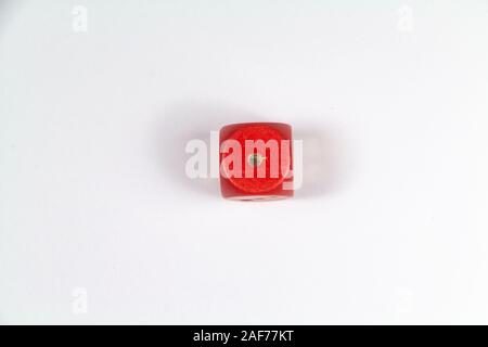 Red dice on number one on white background Stock Photo