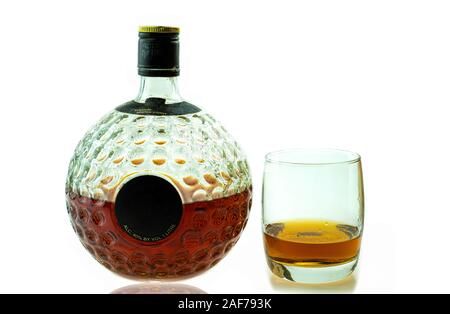 A glass of scotch whiskey premium and old decanter isolated on white background Stock Photo