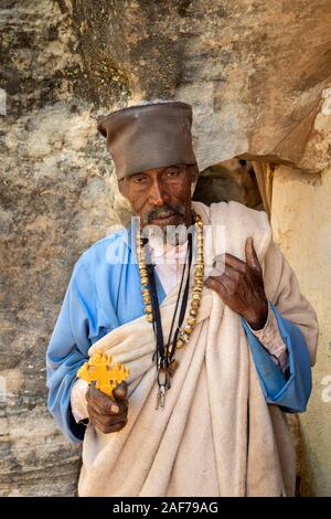Ethiopia, Tigray, Megab, Gheralta Escarpment, priest outside Debre Maryam Korkor rock-cut monastic church Stock Photo