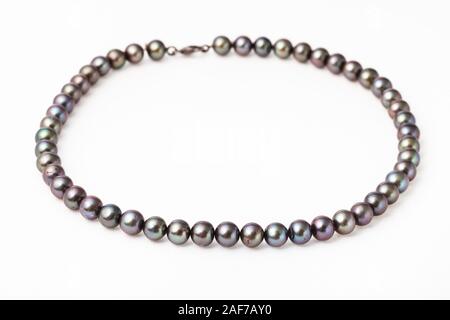 necklace from natural black pearls on white paper background Stock Photo