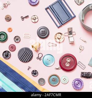top view of set of various sewing accessories on pink background Stock Photo