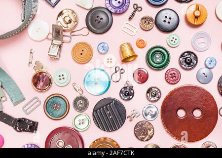 top view of many various sewing items on pink background Stock Photo