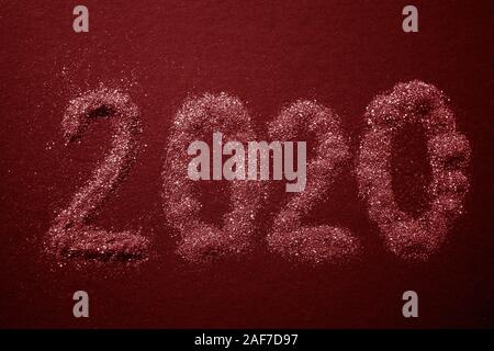 2020 text pattern on red table, top view. Stock Photo