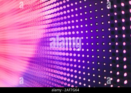 Bright colored blue LED wall with pink pattern - close up background Stock Photo
