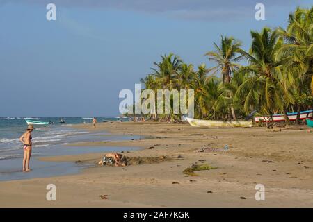 Costa Rica, tropical beach on the Caribbean coast with some tourists, Manzanillo, Limon province, Central America Stock Photo