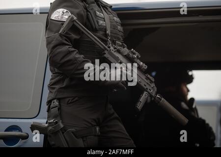 Bucharest, Romania - December 1, 2019: Anti terrorist officer from the Romanian Intelligence Service, armed with a MP7 Heckler & Koch Submachine Gun, Stock Photo