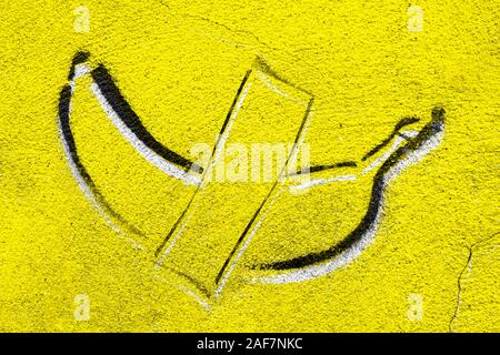 Banana graffiti on concrete wall. Background with copy space. Stock Photo