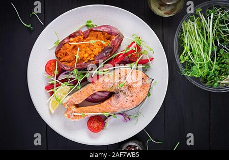 Healthy food: baked salmon and sweet potato and vegetables. Top view , overhead. Diet menu. Copy space Stock Photo