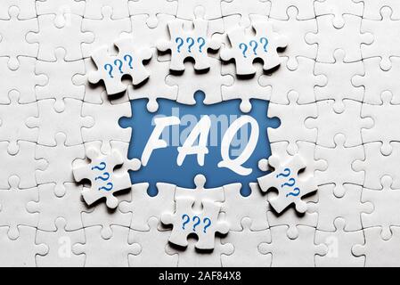 frequently asked questions FAQ concept with jigsaw puzzle Stock Photo