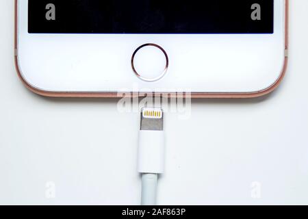 Calgary, Alberta. Canada Dec 12, 2019. Close up of an iPhone Plus and a Lightning to USB Cable. Apple is killing Lightning connector on top iPhones by Stock Photo