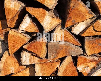 Stacked and chopped firewood to dry Stock Photo