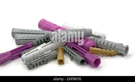 Plastic dowel in front of white background Stock Photo