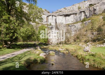 Malham Cove in Yorkshire Dales National Park is a dried up waterfall with a limestone pavement above Stock Photo