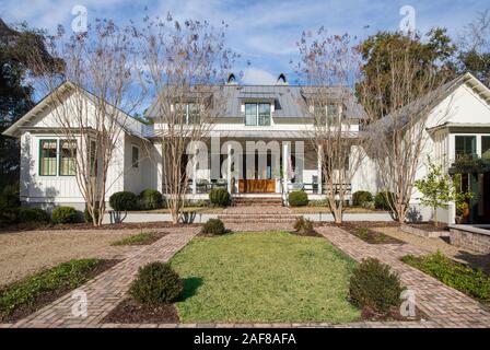 Front view of large expensive two story home with front garden. Stock Photo