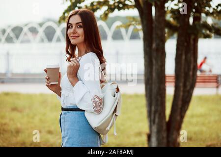 Casual walk. Young woman have good time in the park at her weekend Stock Photo