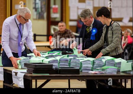 LLANELLI, WALES. 12 Dec 2019. Havard Hughes of the Conservative Party checking the bundles at the Carmarthenshire East & Dinefwr count being held at the Selwyn Samuel Centre in Llanelli. Photo copyright Matthew Lofthouse - Freelance Photographer. Credit: Matthew Lofthouse/Alamy Live News Stock Photo