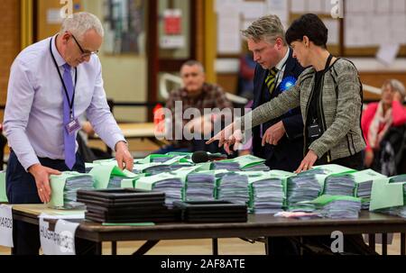 LLANELLI, WALES. 12 Dec 2019. Havard Hughes of the Conservative Party checking the bundles at the Carmarthenshire East & Dinefwr count being held at the Selwyn Samuel Centre in Llanelli. Photo copyright Matthew Lofthouse - Freelance Photographer. Credit: Matthew Lofthouse/Alamy Live News Stock Photo