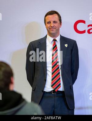 LLANELLI, WALES. 12 Dec 2019. A victorious Jonathan Edwards of Plaid Cymru on the podium after taking the Carmarthenshire East & Dinefwr seat count being held at the Selwyn Samuel Centre in Llanelli. Photo copyright Matthew Lofthouse - Freelance Photographer. Credit: Matthew Lofthouse/Alamy Live News Stock Photo