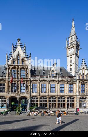 De Post shopping centre and luxury hotel 1898 The Post with clock tower at the Korenmarkt / Wheat Market in the city Ghent, East Flanders, Belgium Stock Photo