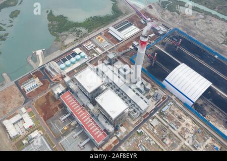 Banten, Indonesia. 13th Dec, 2019. Aerial photo taken on Dec. 13, 2019 shows the power plant PLTU Java 7 in Bojonegara subdistrict of Banten province, Indonesia. Unit 1 of Indonesia's coal-fired power plant PLTU Java 7 developed by a consortium of Chinese and Indonesian companies officially kicked off commercial operation on Friday.   The PLTU Java 7 power plant is currently operated by PT Shenhua Guohua Pembangkitan Jawa Bali which is a joint venture between China Shenhua Energy Co. Ltd. and PT Pembangkitan Jawa Bali - a subsidiary of Indonesia's state-owned electricity firm Perus Credit: Xin Stock Photo