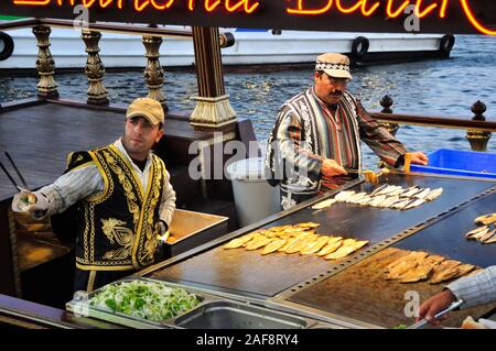 Fried fish sellers near Galata bridge. Eminonu, Istanbul. Turkey Stock Photo