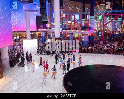 Genting , Malaysia - November 2019 : Indoor theme park event time girls in colorful customs Stock Photo