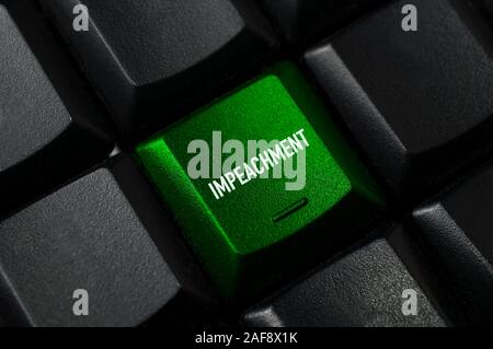 Impeachment concept: a green key on a black computer keyboard with the word impeachment Stock Photo
