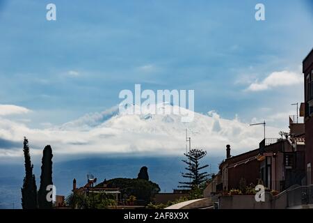 snow covered volcano Etna during abnormally cold spring, Taormina, Sicily Stock Photo
