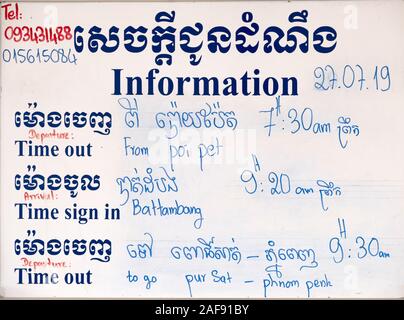 Train schedule board for the Poipet to Phnom Penh service, in Battambang railway station, Cambodia Stock Photo