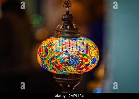 Close up of illuminated multi coloured mosaic glass lamp shade Stock Photo